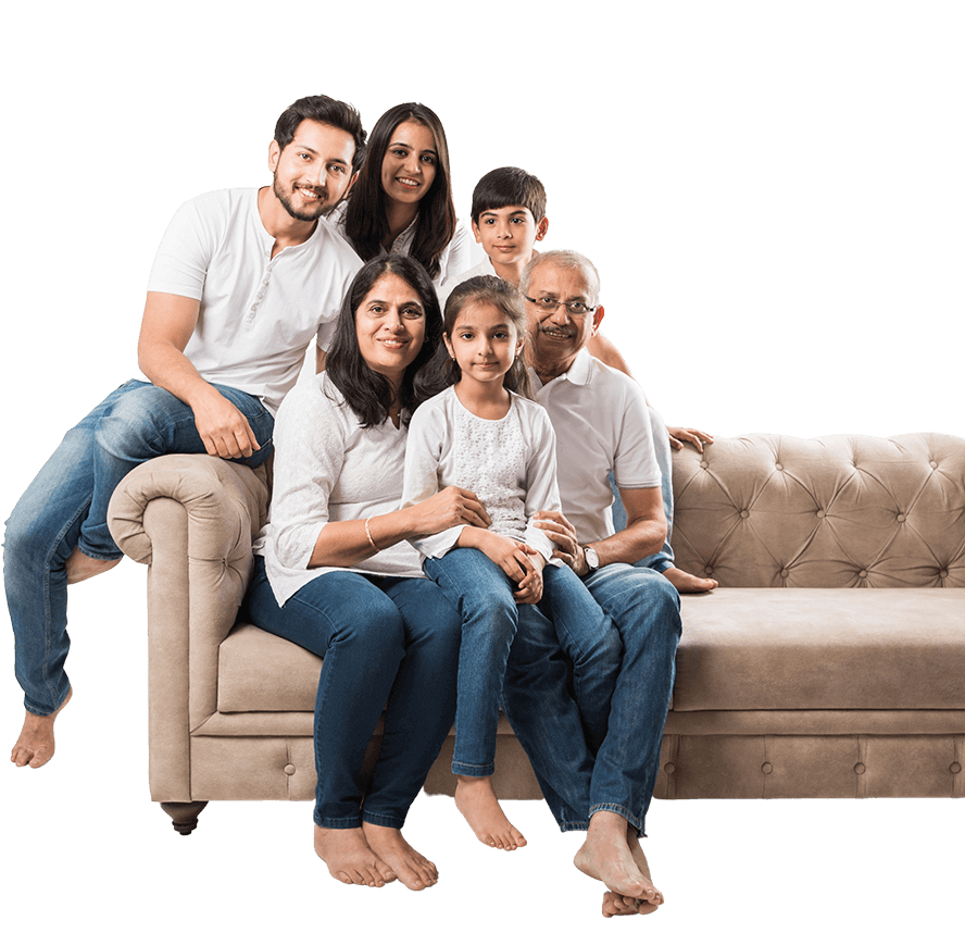 A happy family posing on a couch.