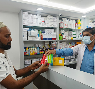 A man buys medicine from a pharmacy.