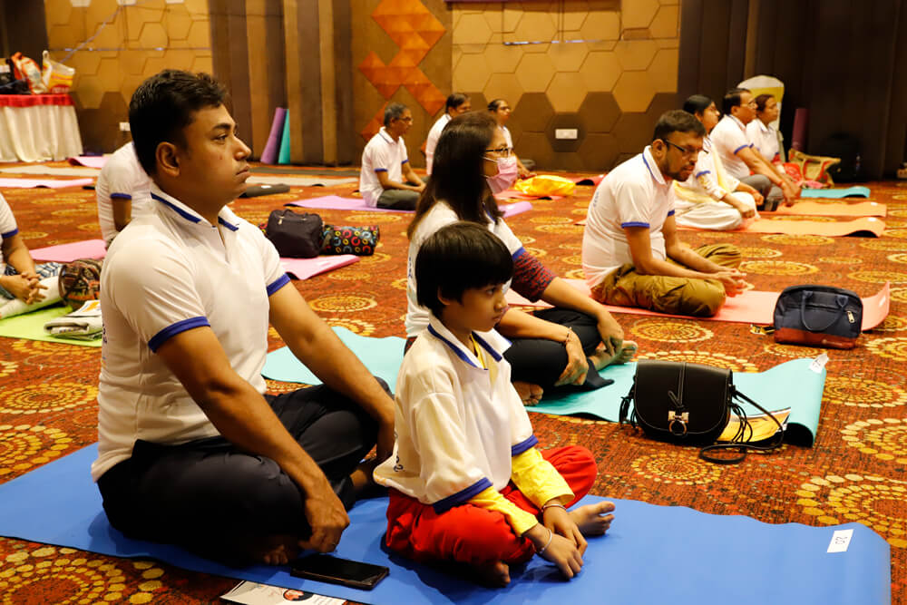 A group of patients sitting on yoga mats at Nephrocare India